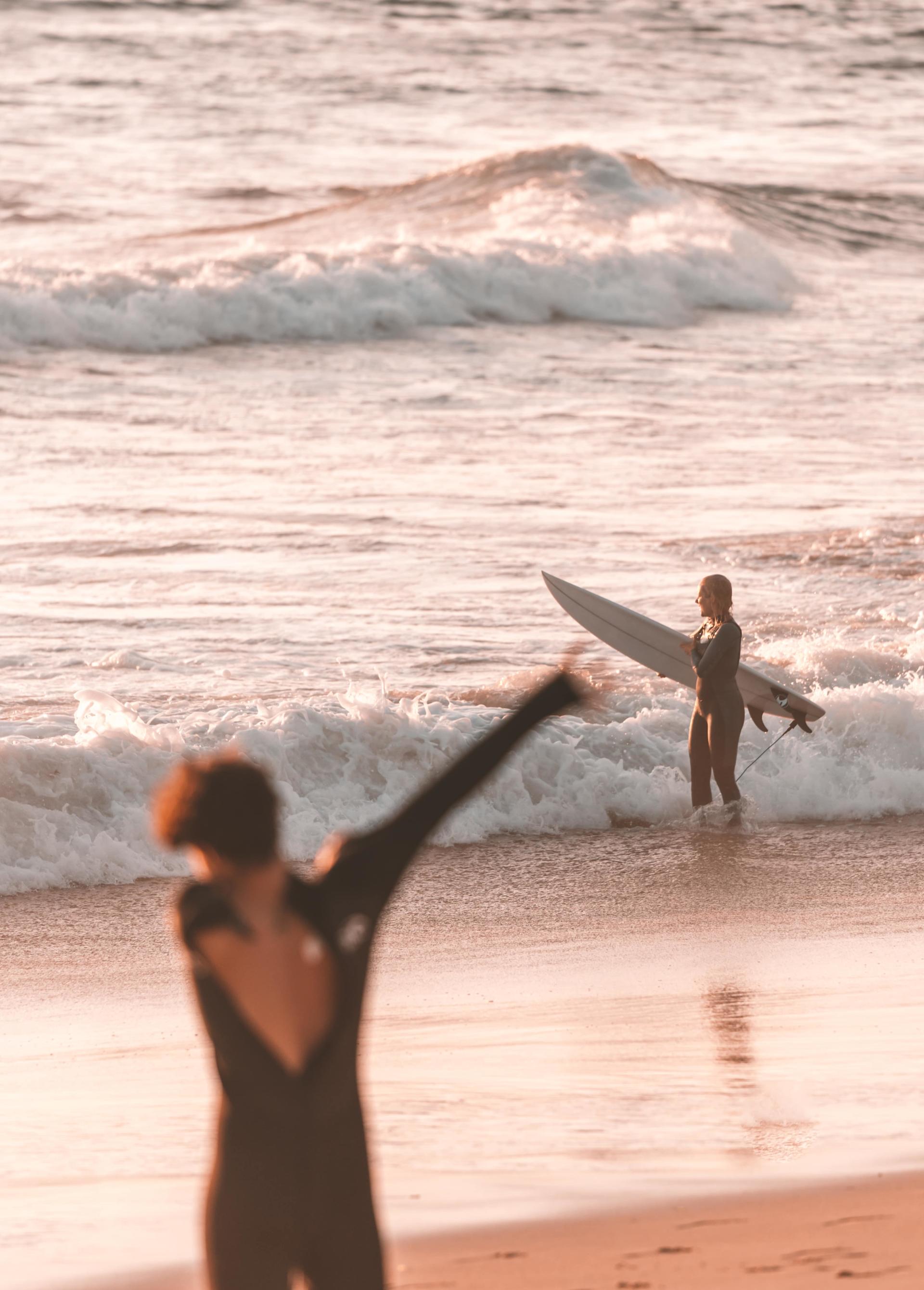 Dressing wetsuit on the beach in Ericeira