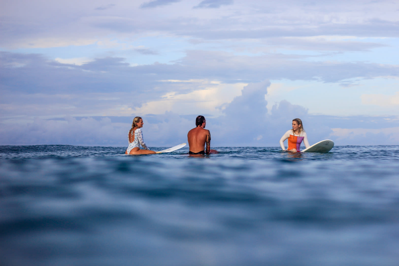 Surfers sitting in the line up Costa Rica
