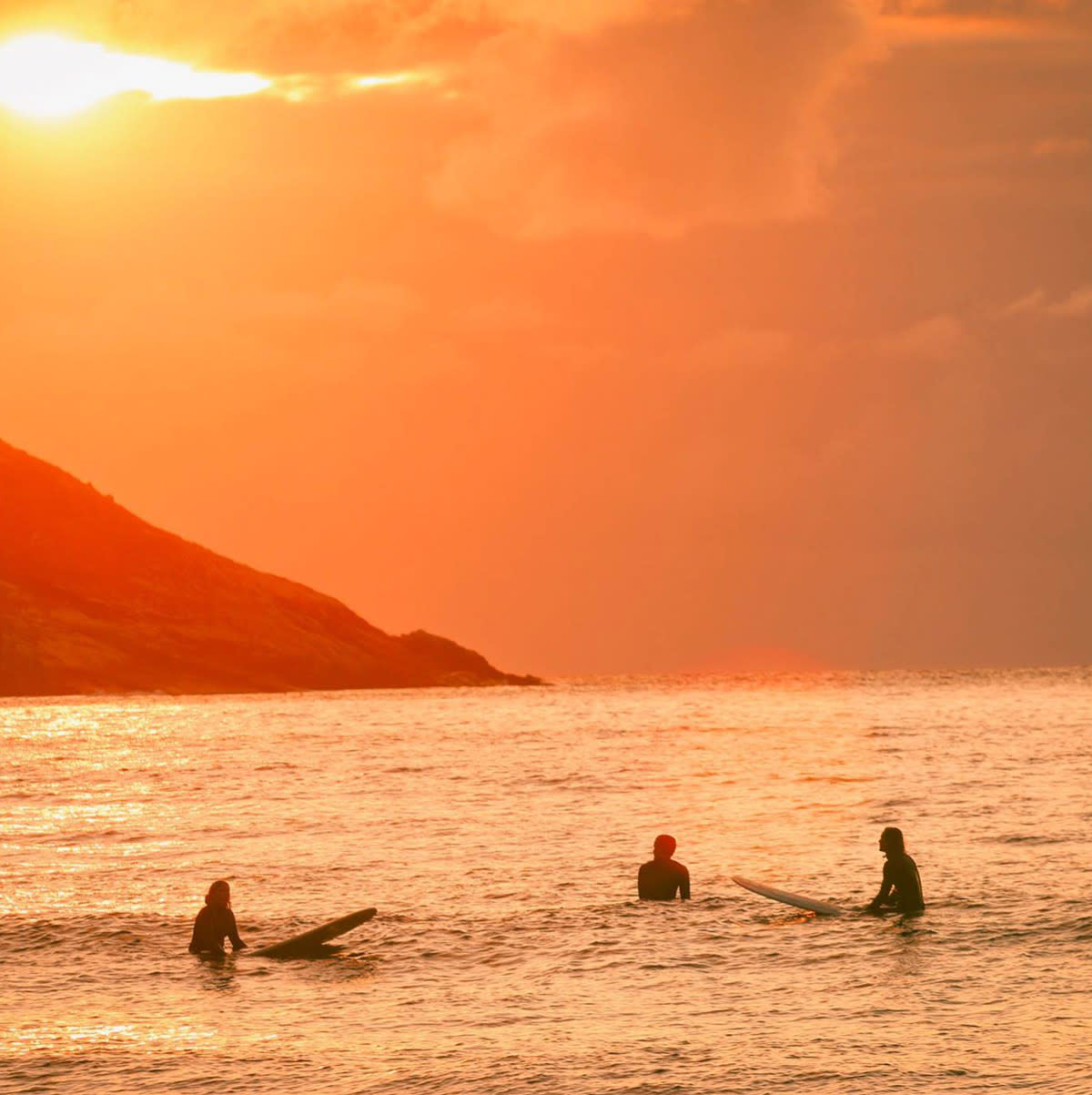 HG3-surfers-in-the-water-at-sunset-lapoint-surf-camps