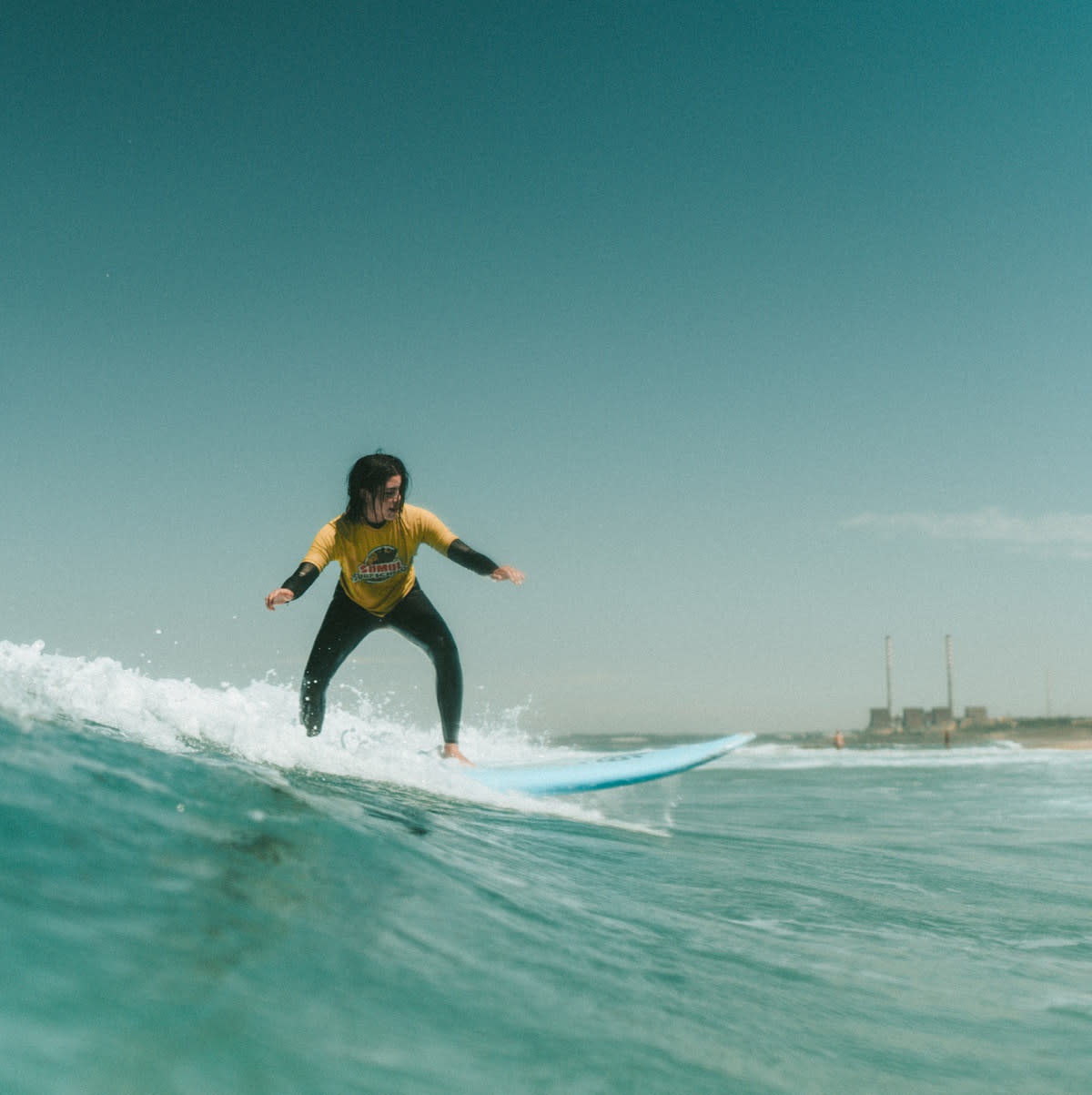 Woman-surfing-foamie-Alentejo-Lapoint-camp
