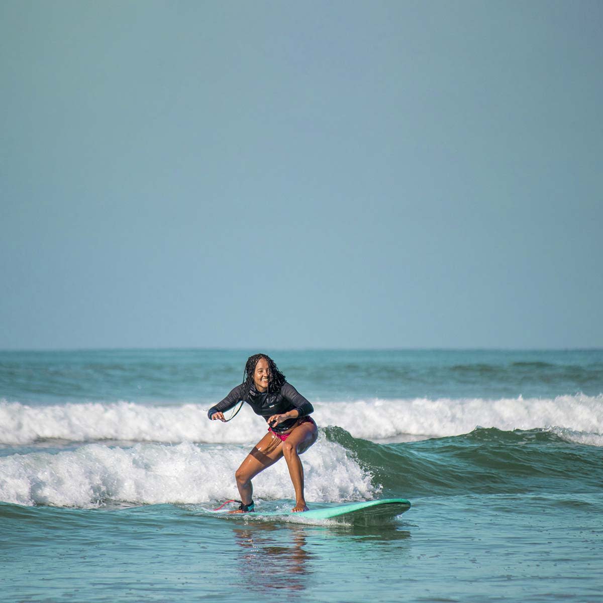 Woman-surfing-Solo-travel-and-learn-to-surf-Lapoint