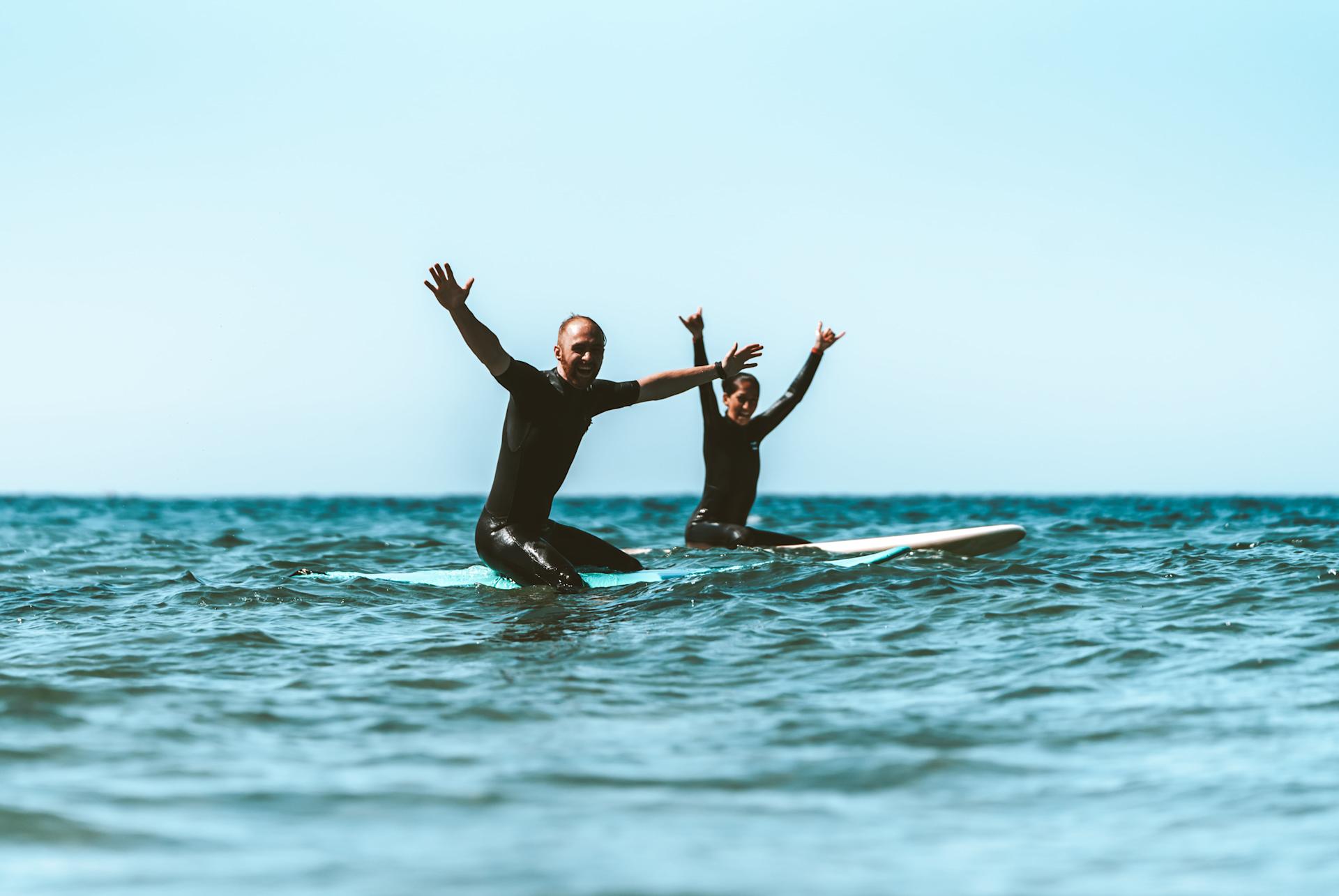 Surfers sitton on board happy in the line up