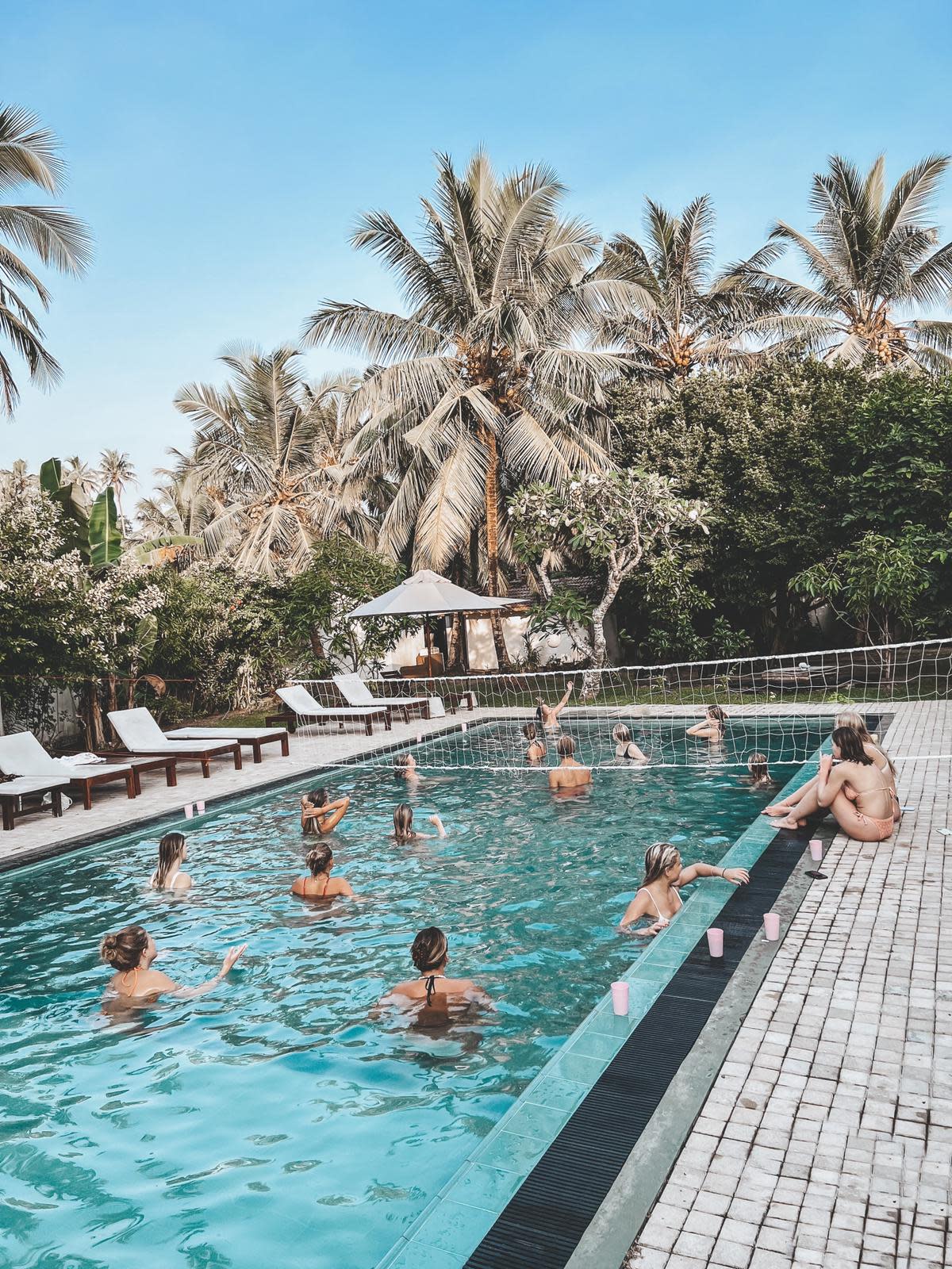 Guests by the swimming pool at Lapoint camp Sri Lanka