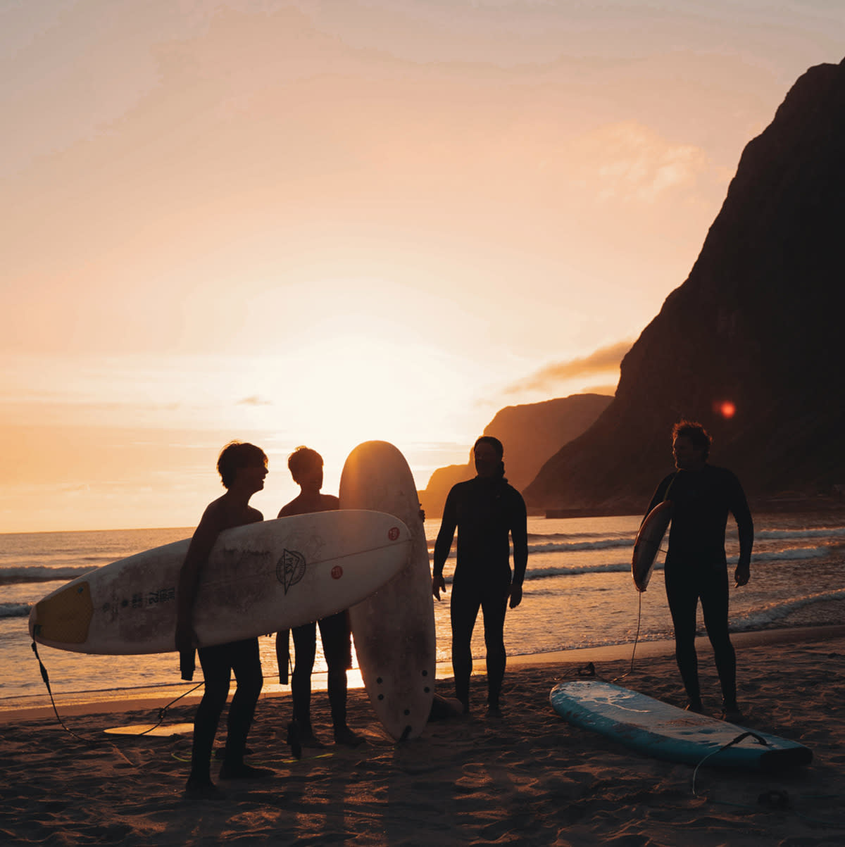 HG1-surfers-at-the-beach-in-sunset-Lapoint-surf-camp