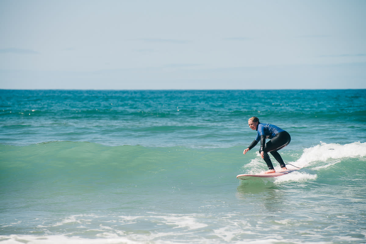 Beginner surfing green wave