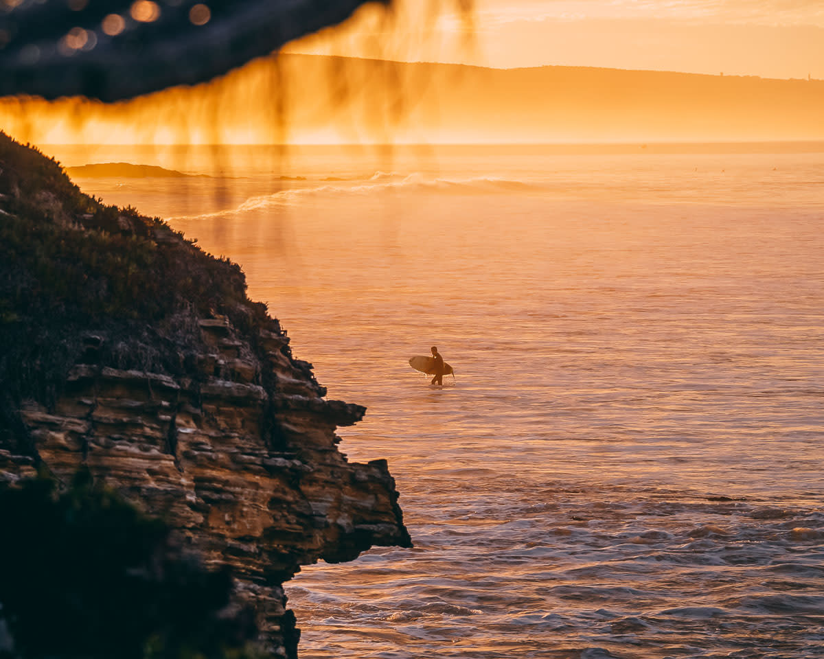 Surfer in sunset morocco