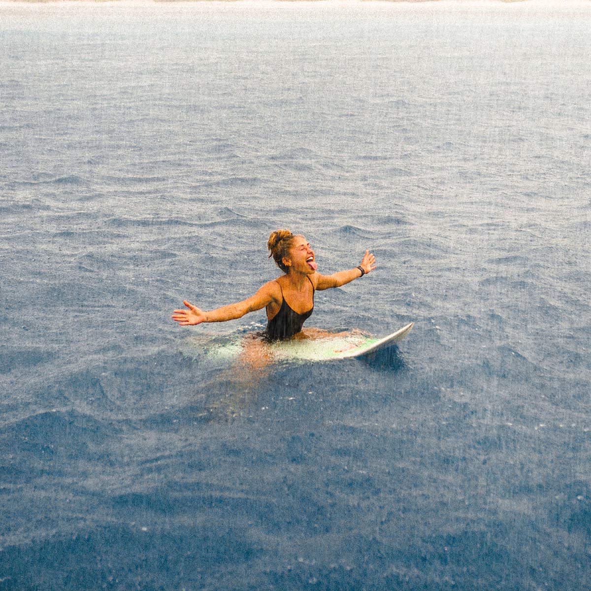 Woman-surfing-in-the-Maldives--Solo-travel-and-learn-to-surf-Lapoint