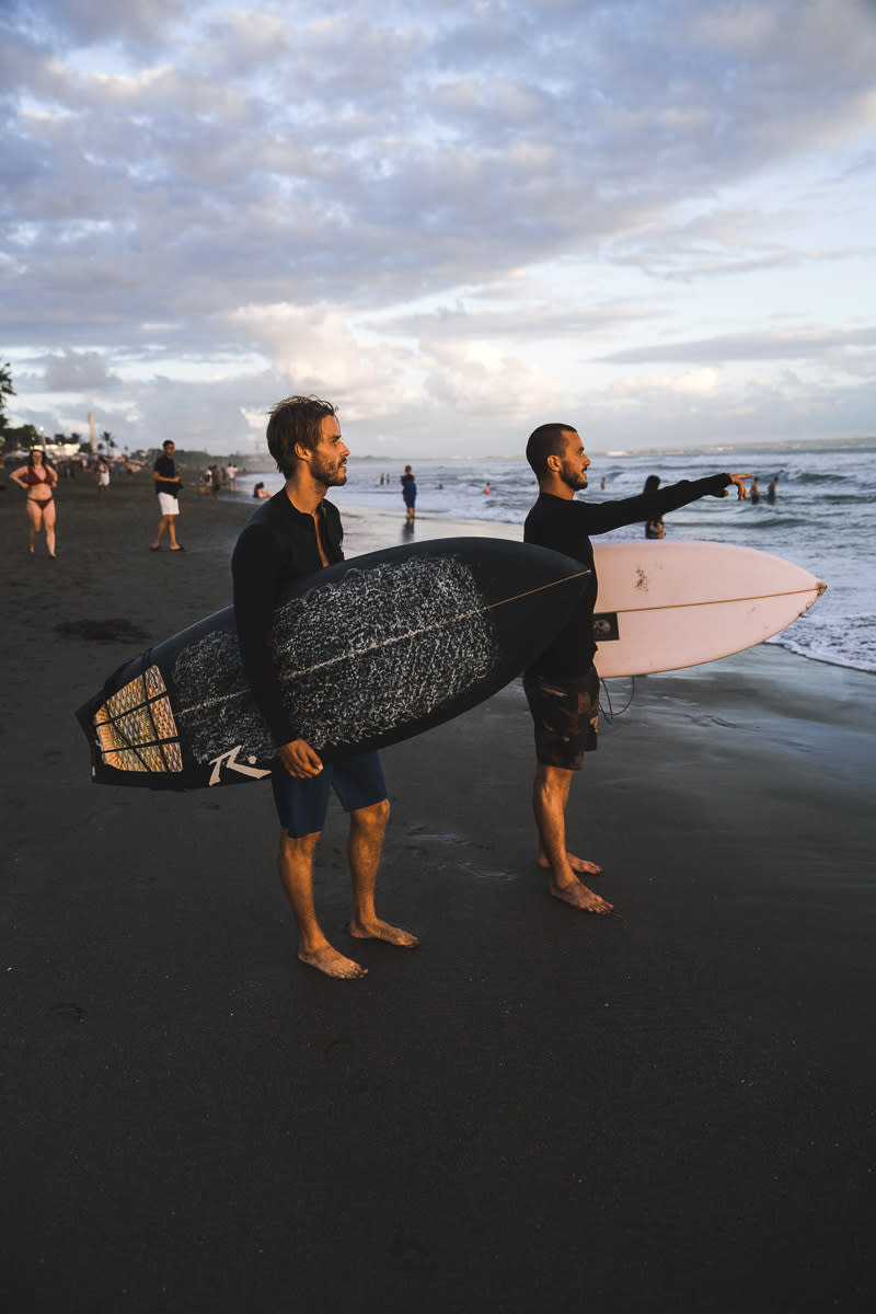 Surfers on beach in Bali
