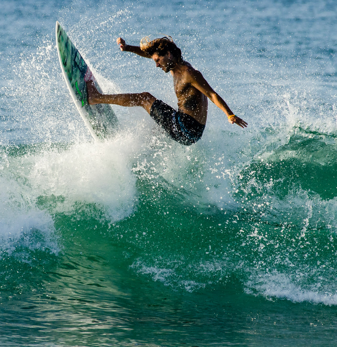 Joao durao surfing without wetsuit