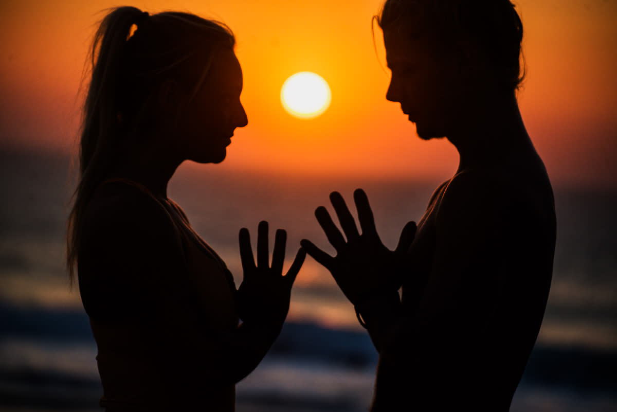 yoga people in sunset