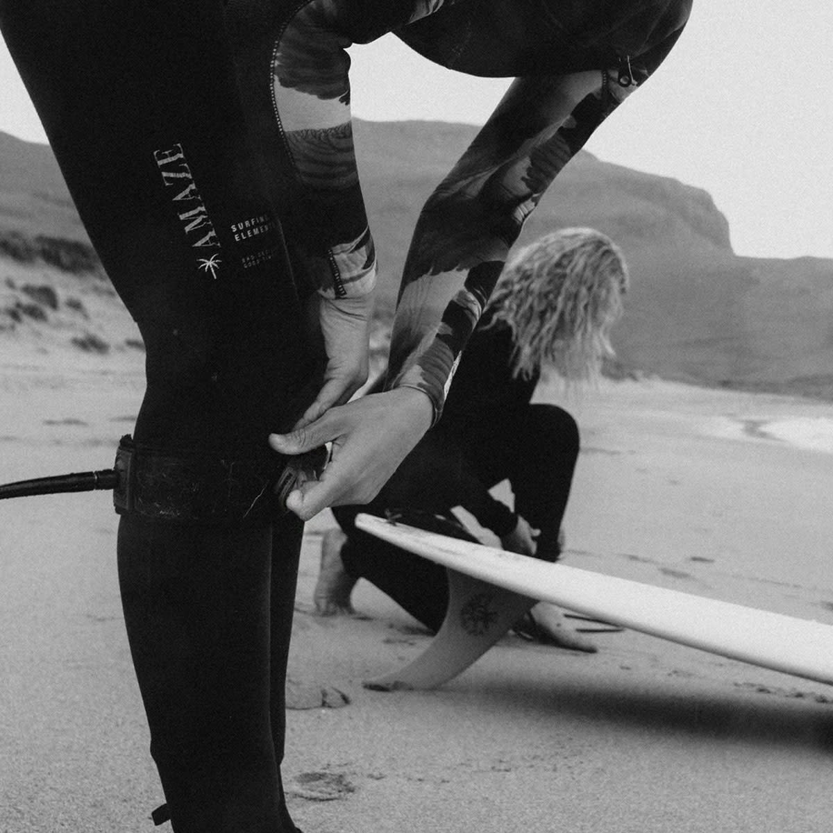 woman-putting-on-wetsuit-hoddevik-lapoint-surf-cmap