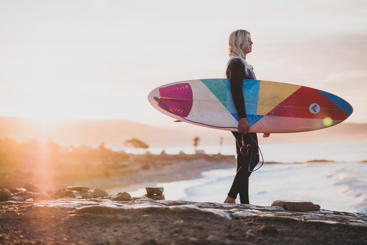 Girl surfer going in