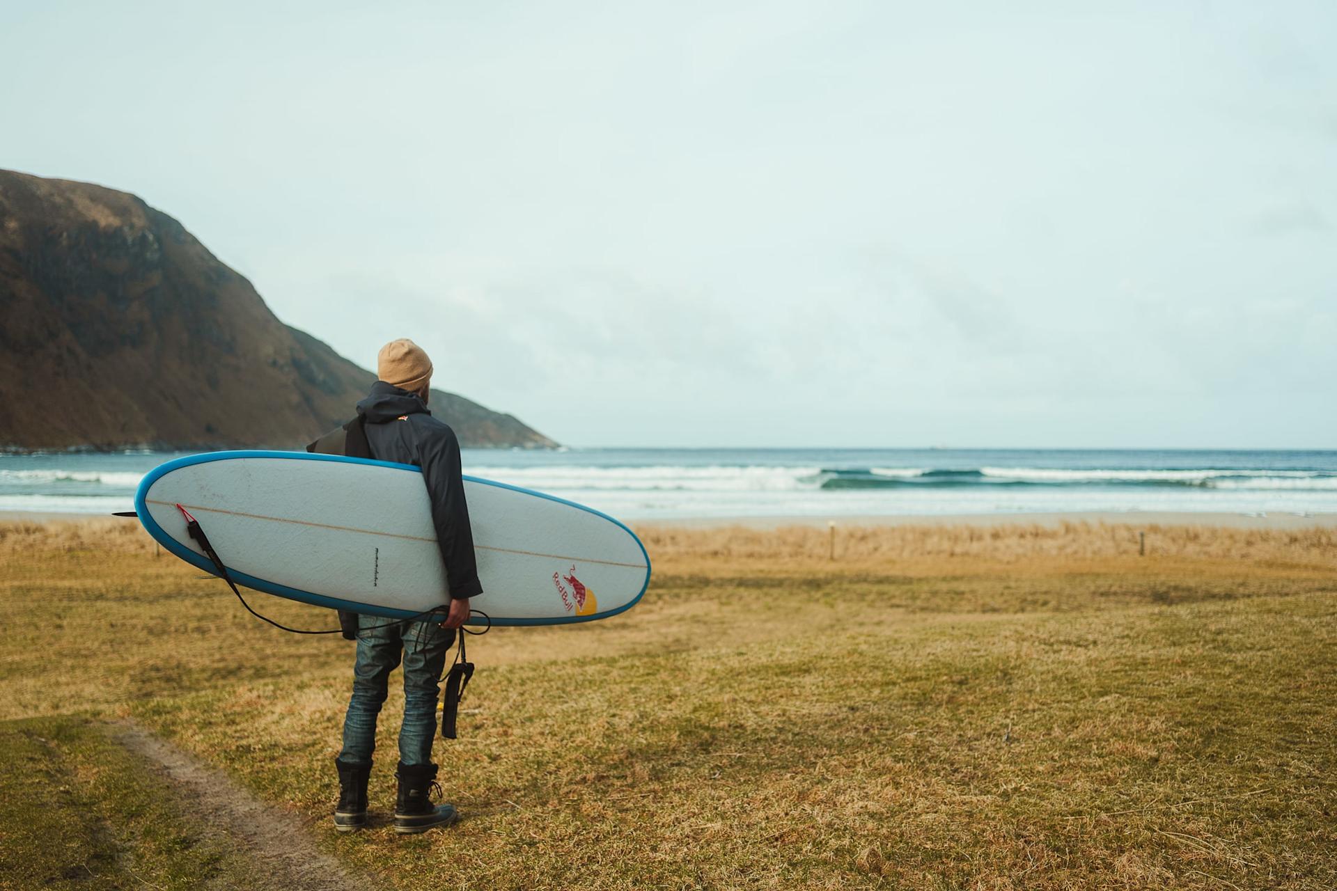 Casper in Hoddevik overlooking the ocean with a board