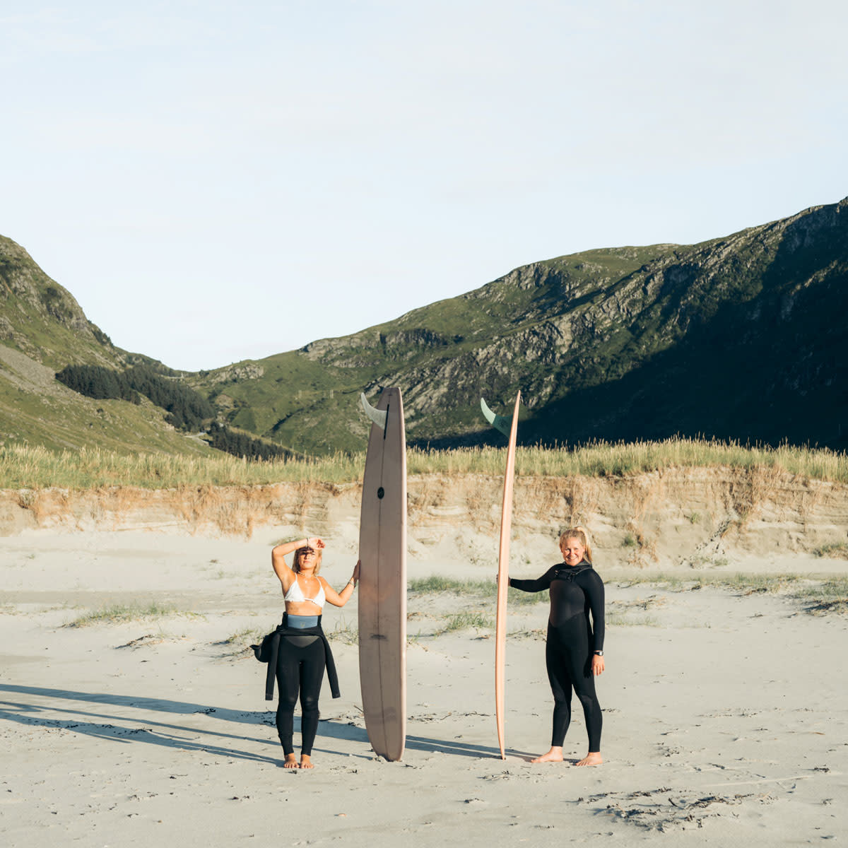 women-holding-surfboards-hoddevik-lapoint-surf-camps