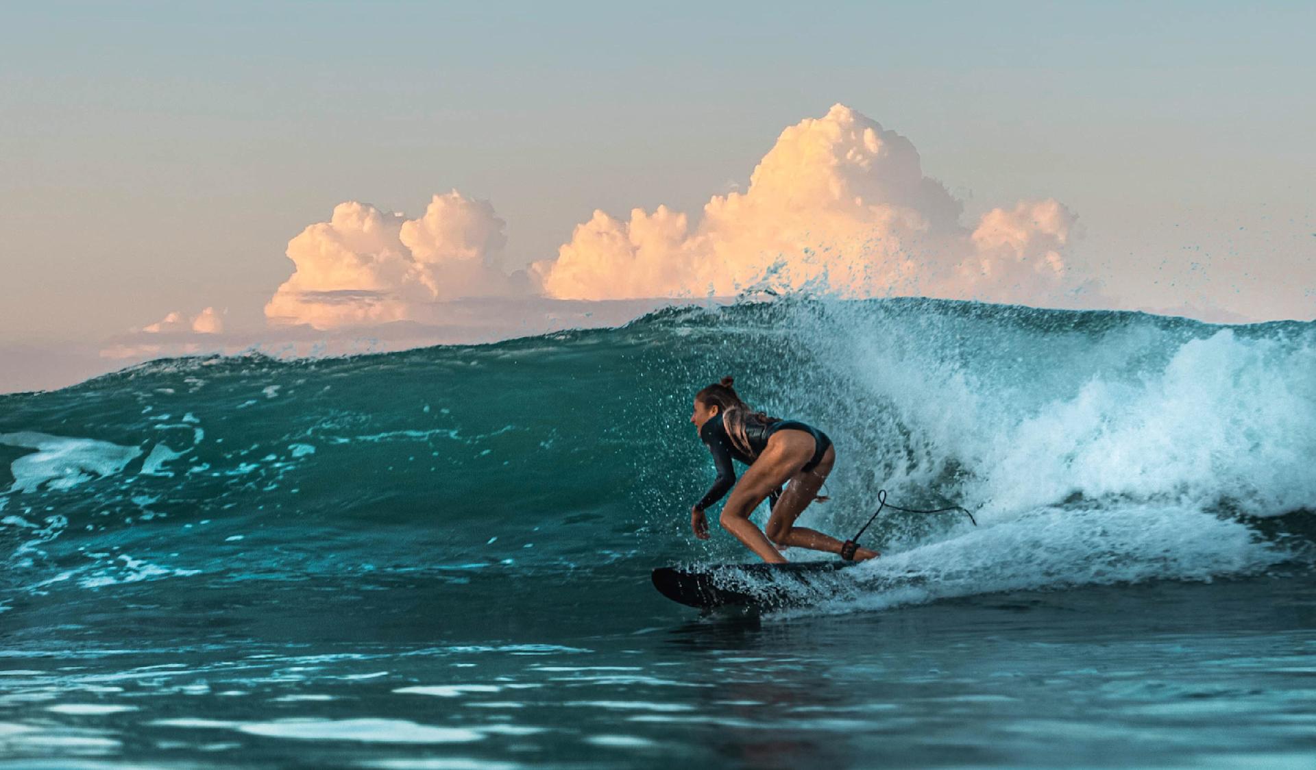 Surfer doing a bottom turn