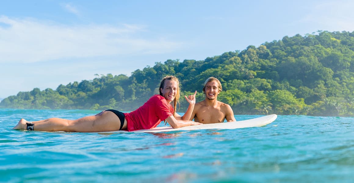 shacka girl on the board in the water costa rica