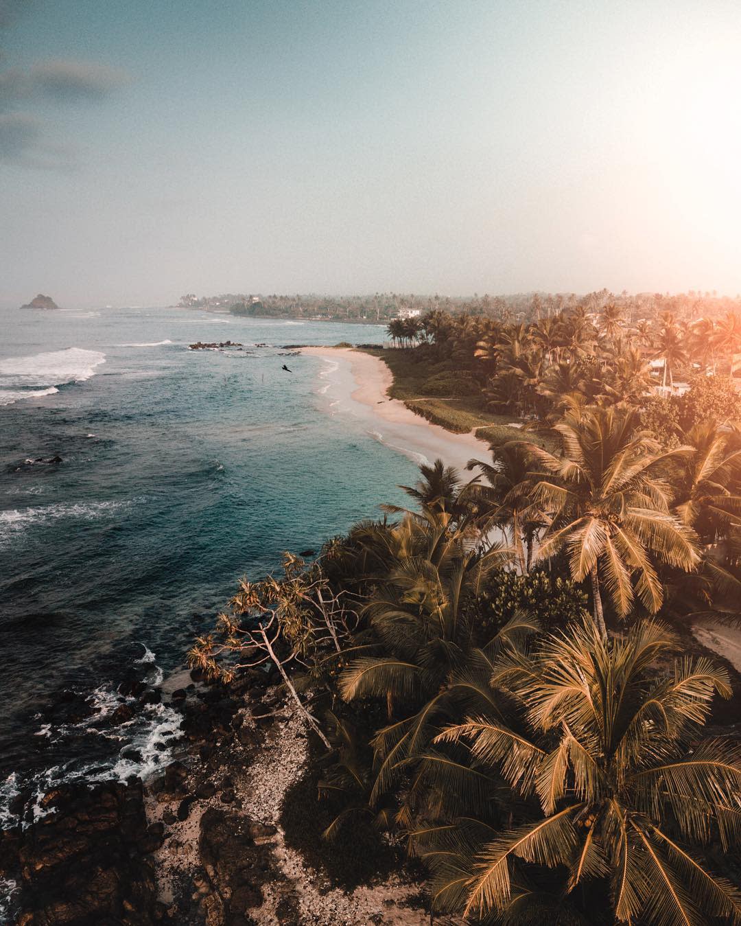 Sri Lanka drone shot beach and palm trees in sunset